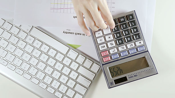 financial-officer-using-calculator-2022-08-03-05-37-54-utc